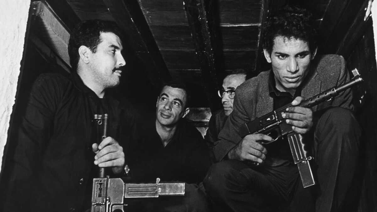 Revolutionaries with guns gather.