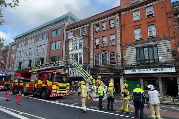 Two people hospitalised after fire at pub in Dublin city centre; Luas line out of service and commuters warned of delays