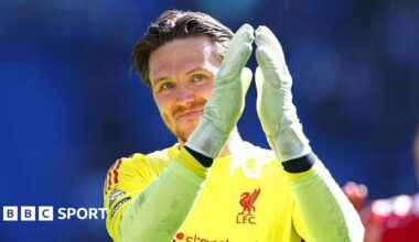 Liverpool goalkeeper Freddie Woodman applauds the crowd after the Merseyside derby
