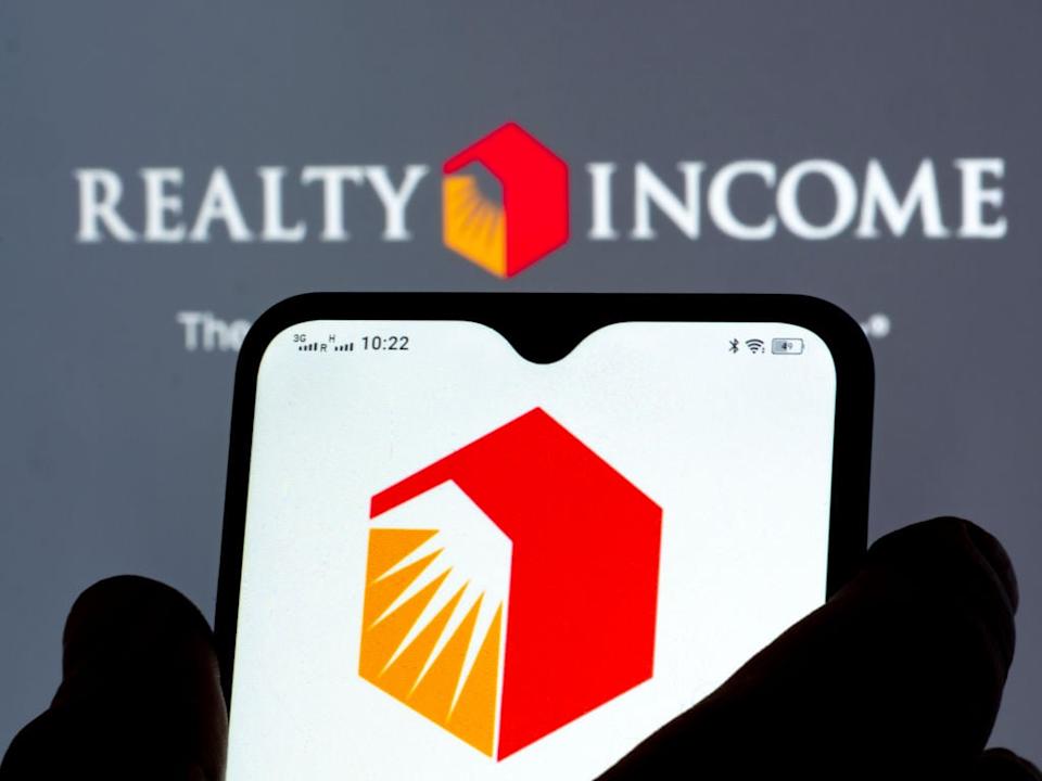 Realty Income's logo on a mobile phone.