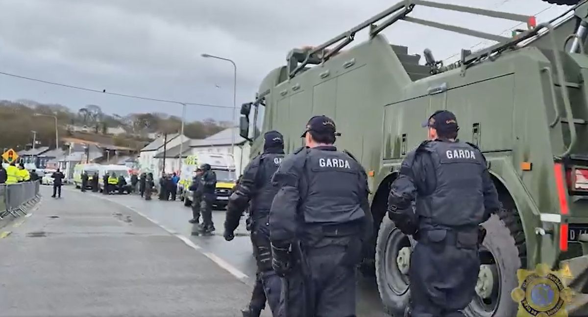 Handout video grab issued by An Garda Siochana of a Defence Forces heavy-lift recovery truck during a major operation involving scores of gardai, where large tractors that had been blocking the entrance to the Whitegate oil refinery in Co Cork were moved and fuel tankers were once again able to access the site.