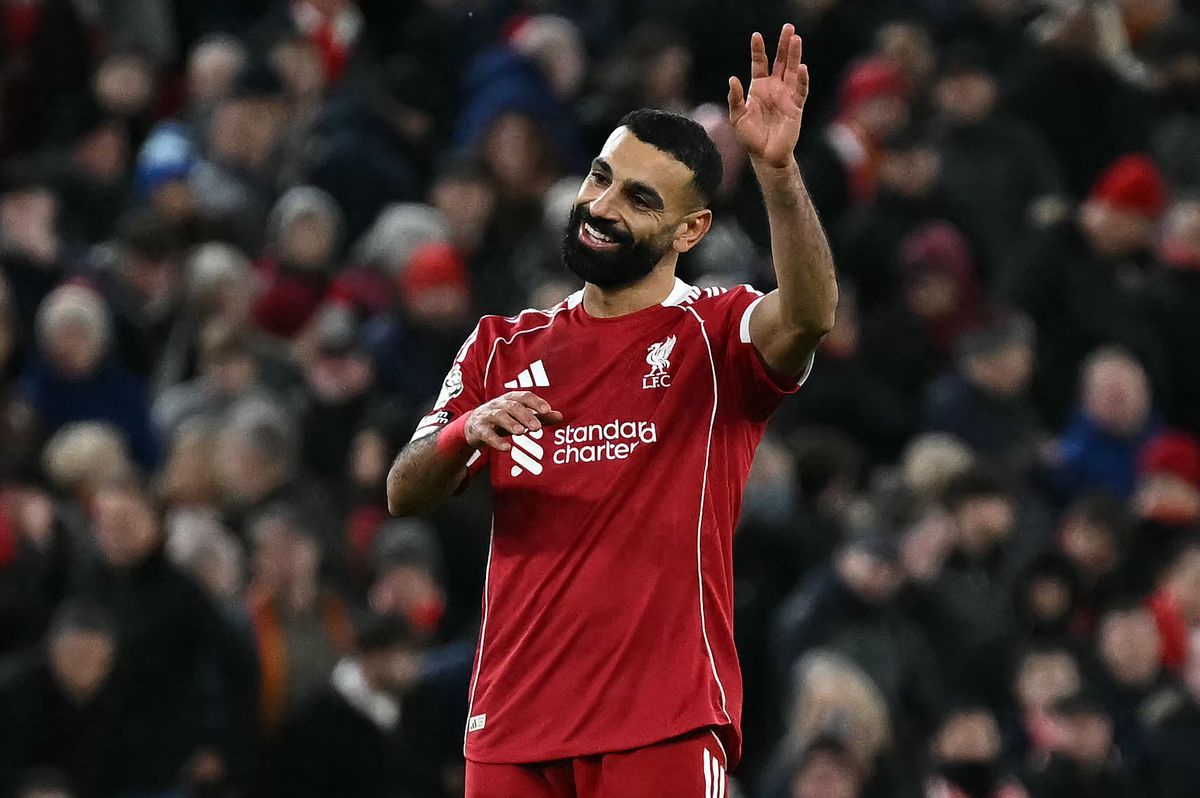 TOPSHOT - Liverpool's Egyptian striker #11 Mohamed Salah applauds the fans following the English Premier League football match between Liverpool and Brighton and Hove Albion at Anfield in Liverpool, north west England on December 13, 2025. Liverpool won the match 2-0. (Photo by Paul ELLIS / AFP via Getty Images) / RESTRICTED TO EDITORIAL USE. No use with unauthorized audio, video, data, fixture lists, club/league logos or 'live' services. Online in-match use limited to 120 images. An additional 40 images may be used in extra time. No video emulation. Social media in-match use limited to 120 images. An additional 40 images may be used in extra time. No use in betting publications, games or single club/league/player publications. /