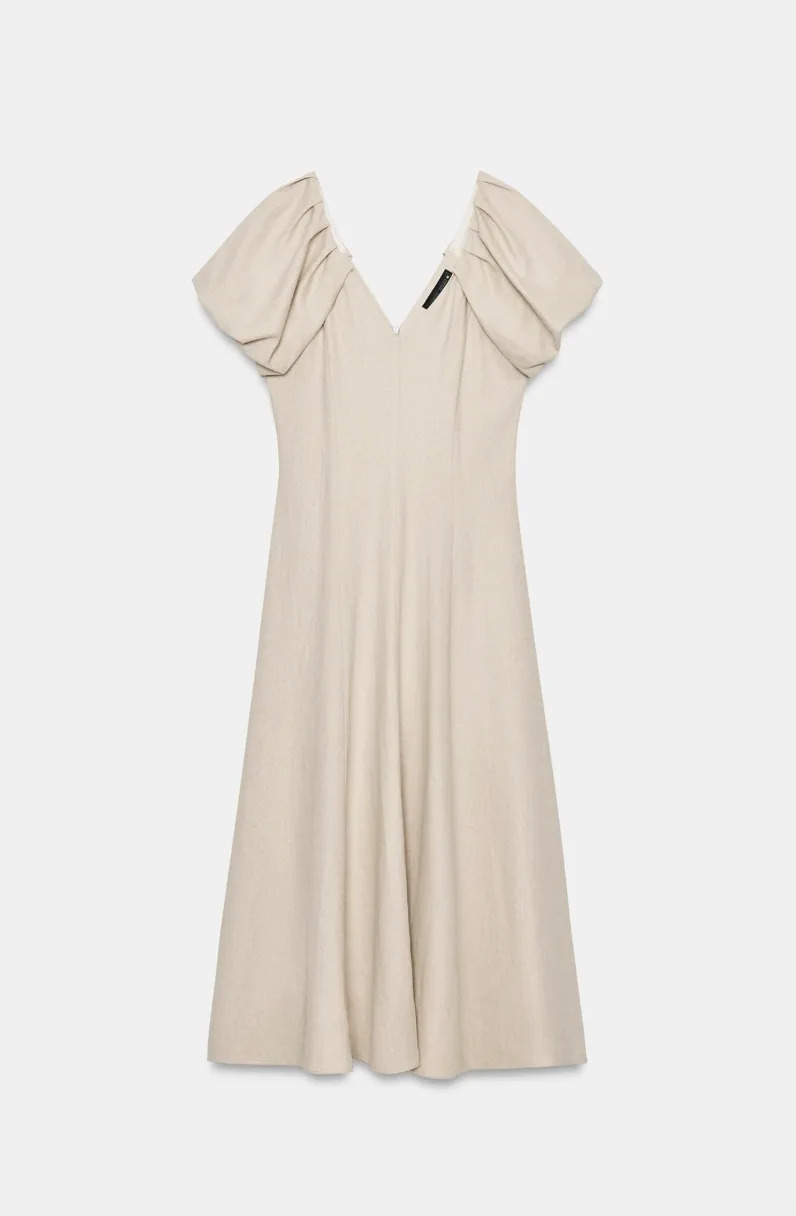 textured lightcolored dress with puff sleeves