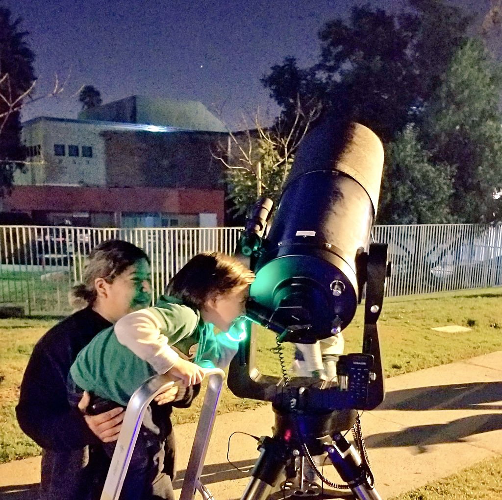 Looking at the stars during a neighborhood astronomy night in Pasadena.