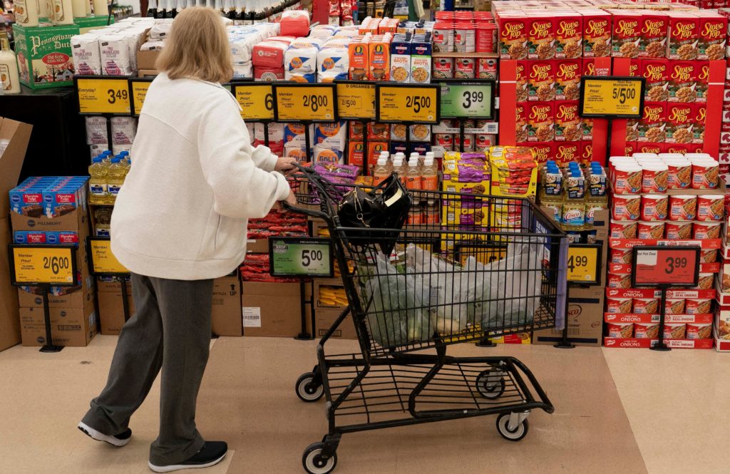 Food shoppers browse the aisles for groceries ahead of the Thanksgiving Day holiday in Redmond