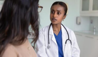 Concerned doctor listens to patient.