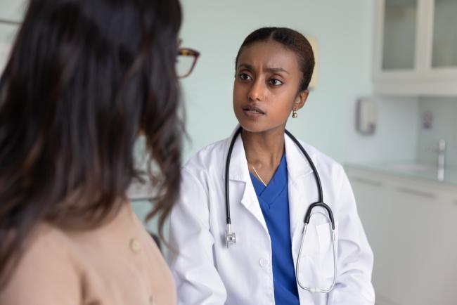 Concerned doctor listens to patient.