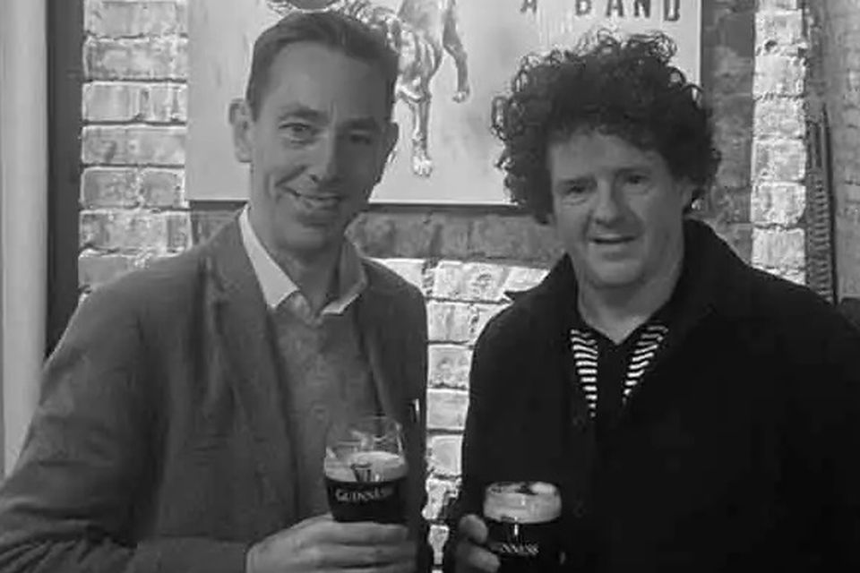 Ryan Tubridy enjoys a pint with bar owner Oisín Rogers