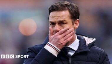 Scott Parker holds his face