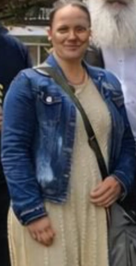 Closeup of woman with many fingers wearing a denim jacket and yellow dress