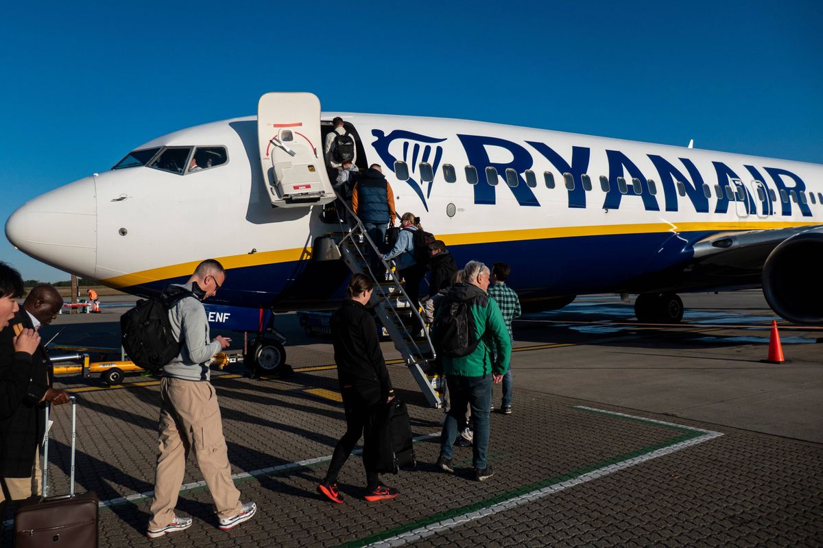 Passengers waiting in line and boarding a Ryanair low cost airline airplane at London Stansted Airport in the UK. The Boeing 737-800 passenger aircraft of the budget carrier has the registration tail number EI-ENF. Ryanair is an Irish Ultra Low-cost carrier group with headquarters in Dublin, Ireland with a fleet of 607 planes. Stansted Airport is the tertiary international airport serving London, the capital of England and the United Kingdom, fourth busiest in the UK owned by Manchester Airports Group. Stansted, United Kingdom on October 11, 2024 (Photo by Nicolas Economou/NurPhoto via Getty Images)