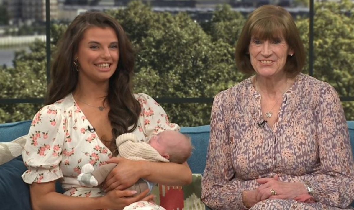 A woman holding a baby