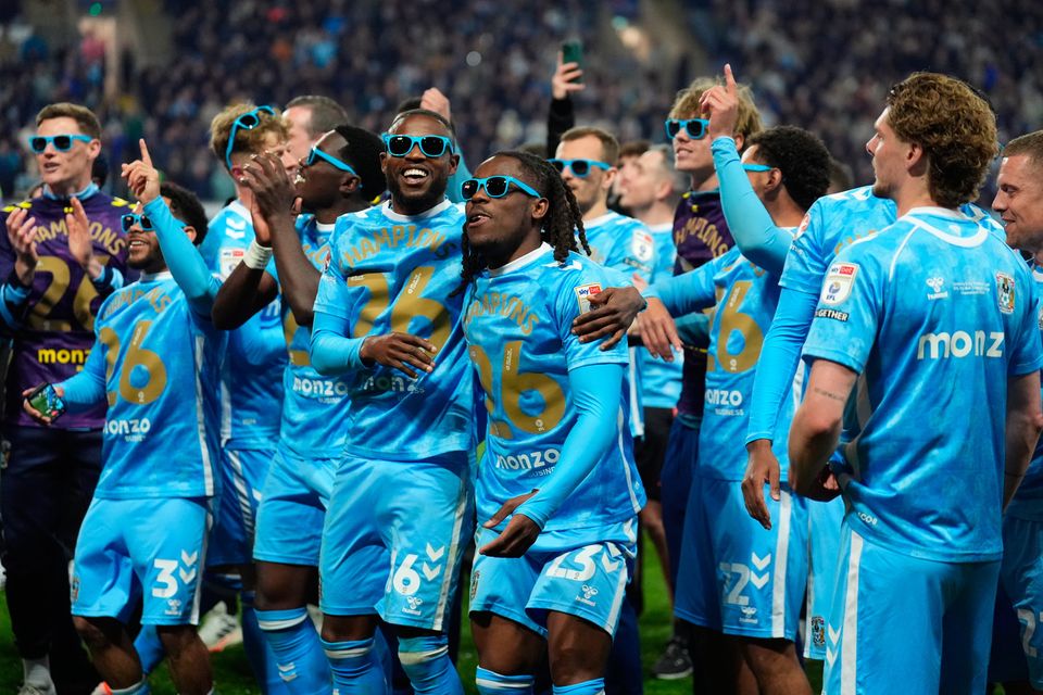 Coventry City's Frank Onyeka and Brandon Thomas-Asante celebrate sealing the Championship title last night. Photo: Mike Egerton/PA Wire