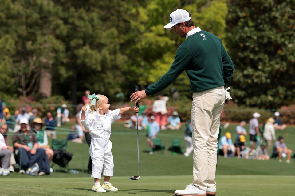 Golf - The Masters - Augusta National Golf Club, Augusta, Georgia, U.S. - April 8, 2026
Harris English of the U.S. with his daughter Emilia on the 3rd hole during the par 3 contest REUTERS/Kylie Cooper