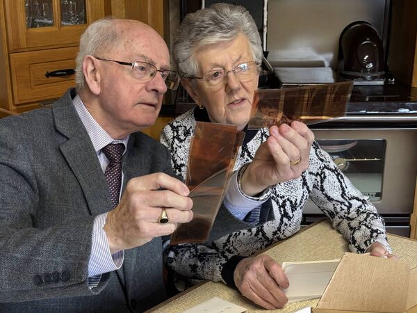 Michael and his wife Mae, looking over Michael's prints