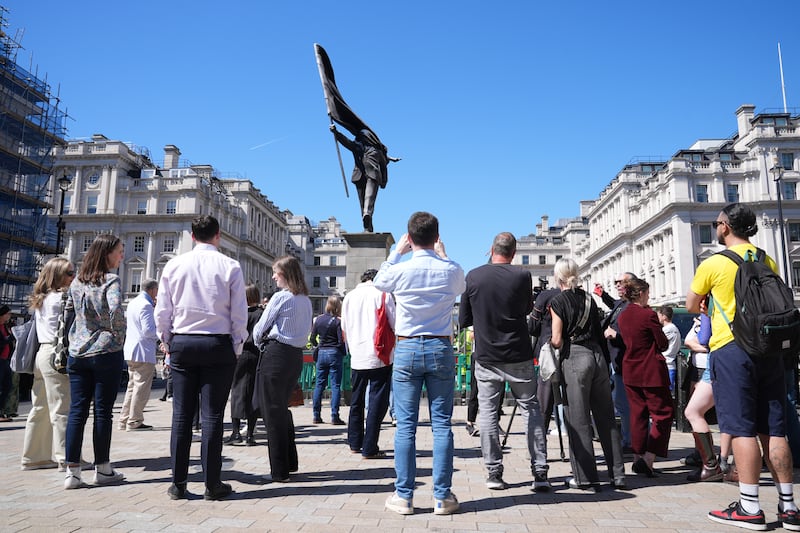 People take pictures of Banksy's latest statue. Photograph: Lucy North/PA Wire