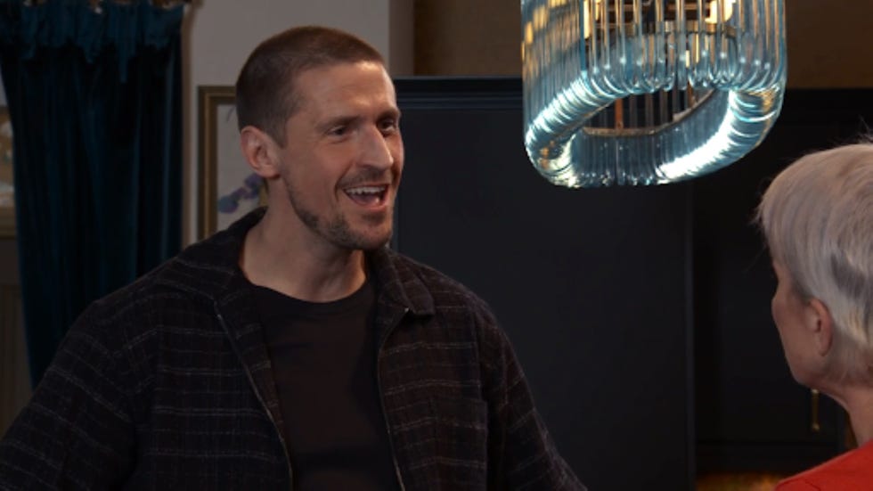 conversation between two individuals in a stylish room