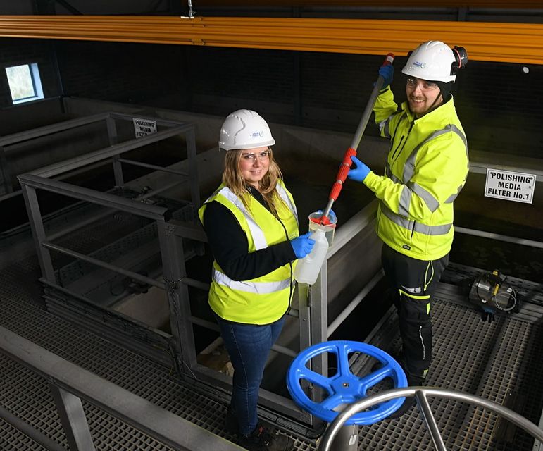 Michael McMenamin and Sabrina Mongan collecting and recording water samples helping ensure water quality meets environmental and regulatory standards across Co Donegal.