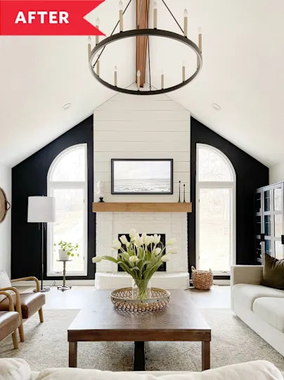 After: Large black and white living room with tall white fireplace