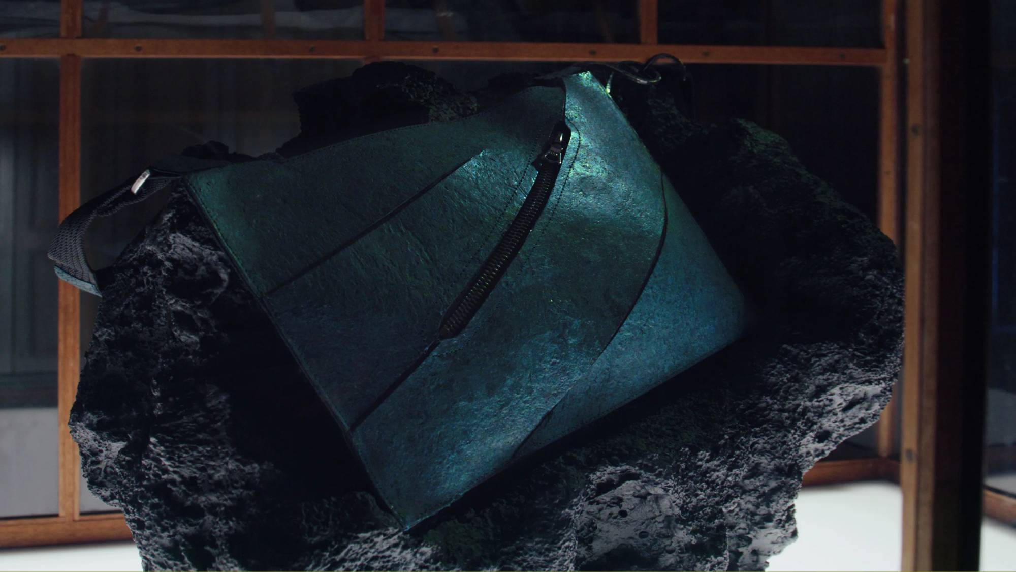 A close up of the world's first dinosaur leather product in a glass box