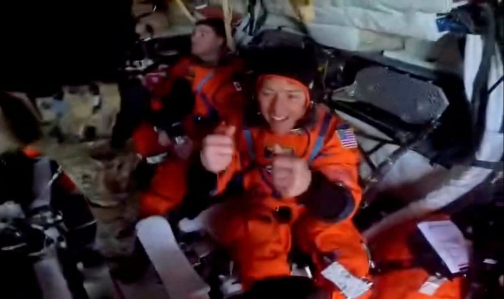 Astronauts greet recovery personnel inside the Artemis II crew capsule floating in the Pacific Ocean following splashdown on April 10. Photo: Instagram/Astro_Reid/Reuters