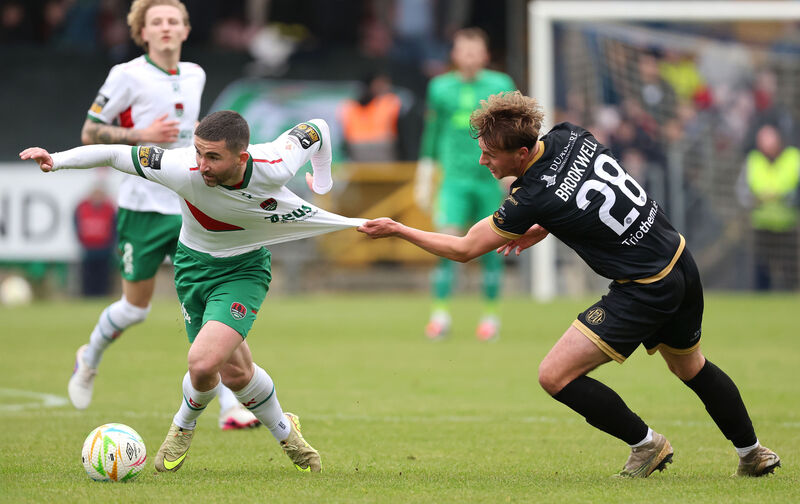  Sean Maguire, Cork City FC, tries to shake off Niall Brookwell, Kerry FC. Picture: Jim Coughlan.