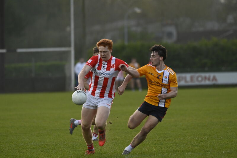 Diarmuid Phelan of Imokilly holds off MTU Cork's Daire Murphy. Picture: Noel Sweeney
