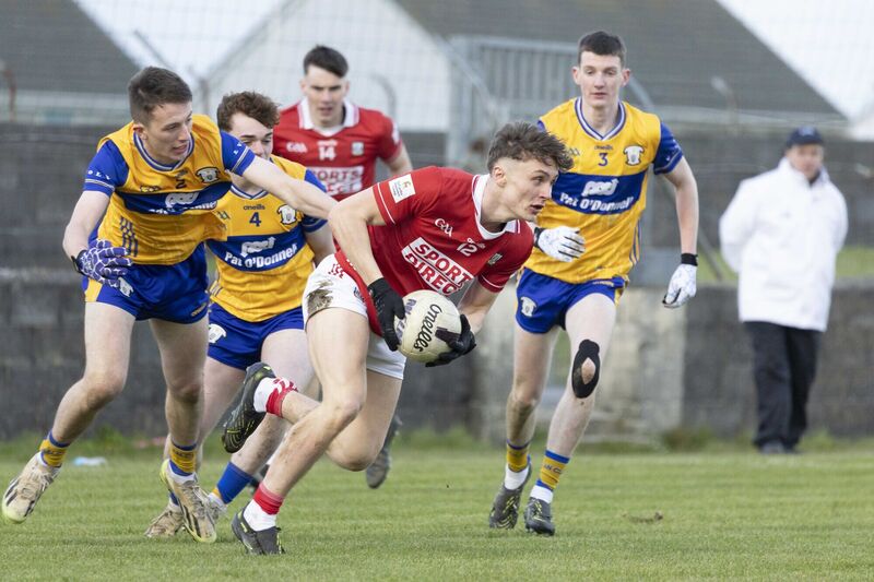 Cork's Gary Holland and Clare's Aidan Weaver and Aaron Killeen in action. Picture: Eamon Ward