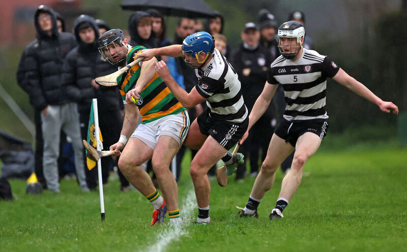 Dean Brosnan of Glen Rovers is forced over the sideline by Midleton's Killian McDermott. Picture: Jim Coughlan