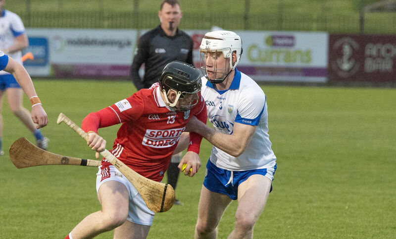 Cork's Finn O'Brien attempts to break past Waterford's Conor Lynch. Pic: Howard Crowdy.