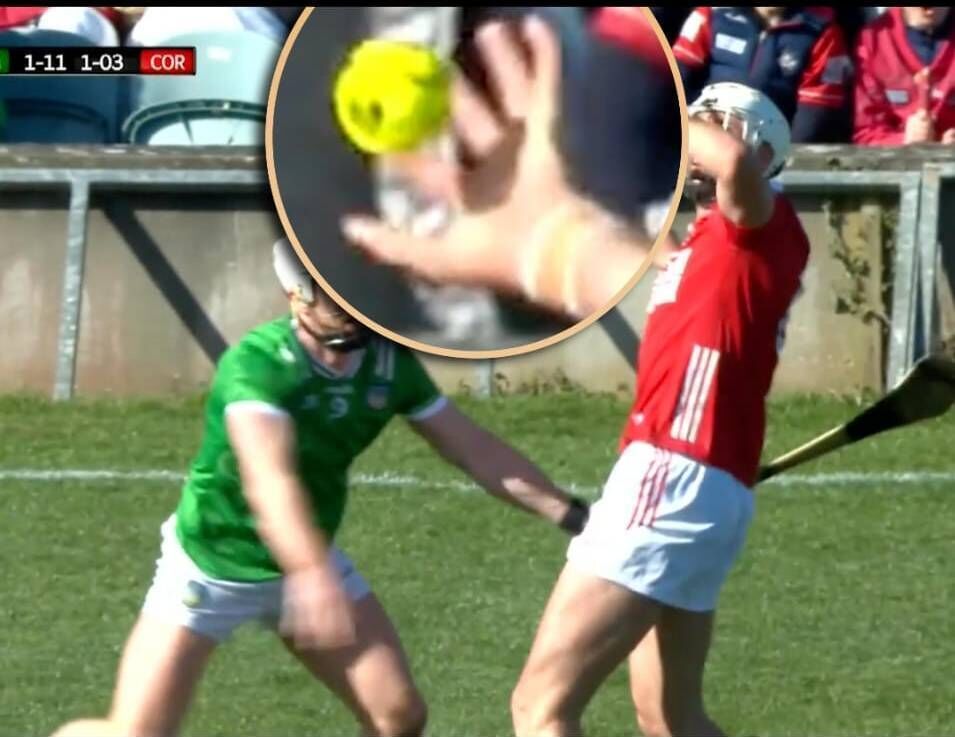 Tim O'Mahony of Cork completing a handpass against Limerick.