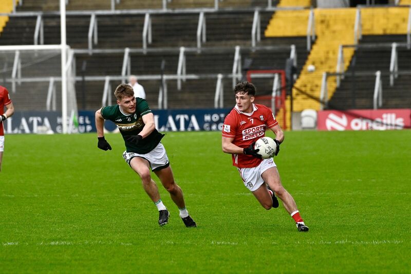 Cork’s Odhran Foley sails past Daniel Kirby of Kerry. Picture: Noel Sweeney
