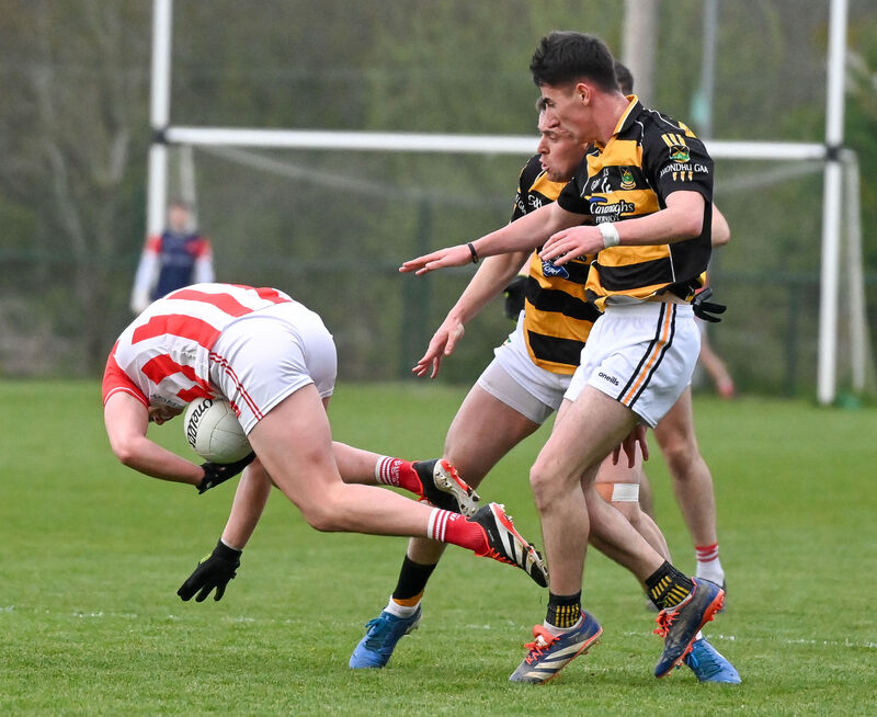  Imokilly's Daniel Murnane is tackled by Avondhu's Aaron Trimm. Picture: David Keane