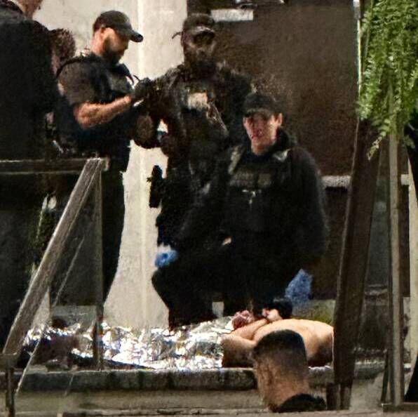 Members of law enforcement control shooting suspect Cole Tomas Allen during the White House Correspondents Dinner, Saturday, April 25, 2026, in Washington. Picture: AP Photo/Alex Brando