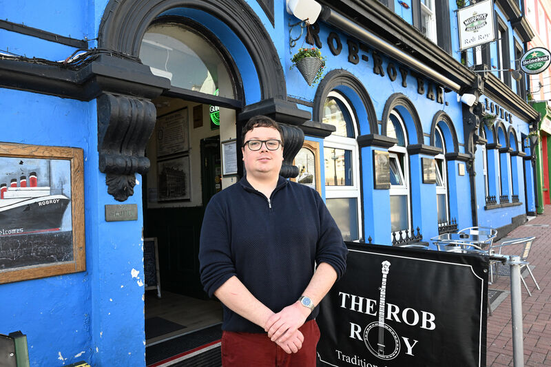 Eoin McCarthy outside his pub, the Rob Roy Bar, in Pearse Square, Cobh. He says: “When the cruise ships arrive, there is always a buzz.” Picture: Larry Cummins