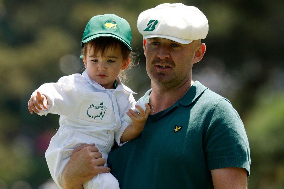 Golf - The Masters - Augusta National Golf Club, Augusta, Georgia, U.S. - April 8, 2026
England's Harry Hall with his daughter Lilah Hall on the 2nd hole during the par 3 contest REUTERS/Brian Snyder
