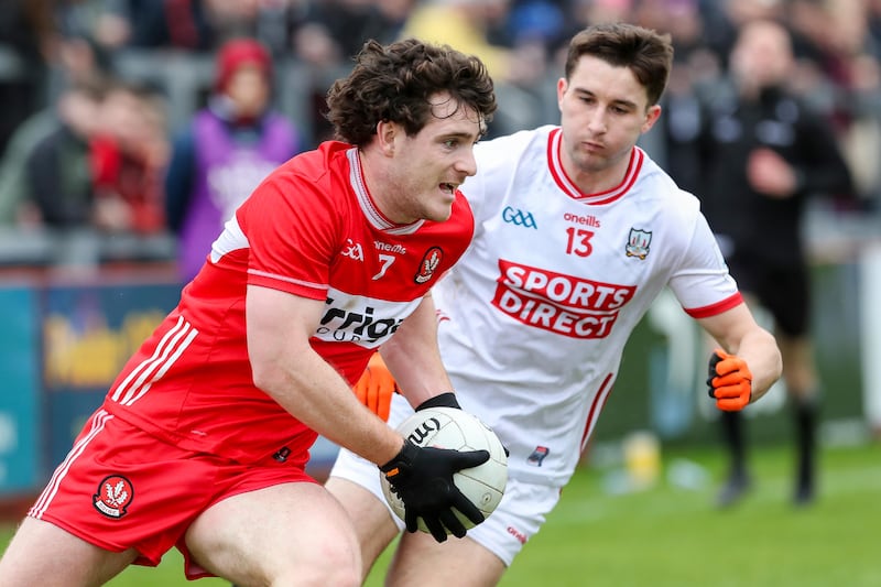 Derry's Padraig McGrogan and Cork’s Chris Óg Jones in Celtic Park, March 1st. Photograph: Lorcan Doherty/Inpho