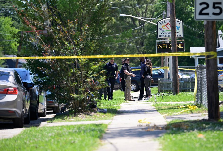 Police gather as they work at the scene of a mass shooting in Shreveport (Jill Pickett/The Times-Picayune/The New Orleans Advocate via AP)