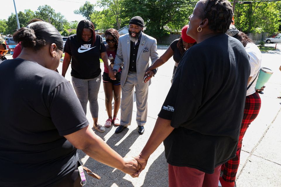 Rev. Steven J. Newton Sr. leads a prayer circle after children, with ages ranging from 1 to 14, were killed in a mass shooting incident described as domestic violence, in Shreveport, Louisiana, U.S. April 19, 2026.  REUTERS/Kevin Bartram