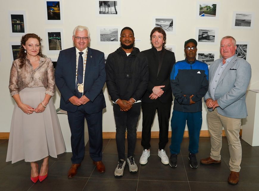 Stephanie Warner, Cathaoirleach Joe Sullivan, Emmanuel Ehikioya, JP Keating, Barkhad Mire and Cathaoileach Donal Kenny at the Art Exhibition in collaboration with JP Keating at Gorey Library. PHOTO: Sabrina Ffrench