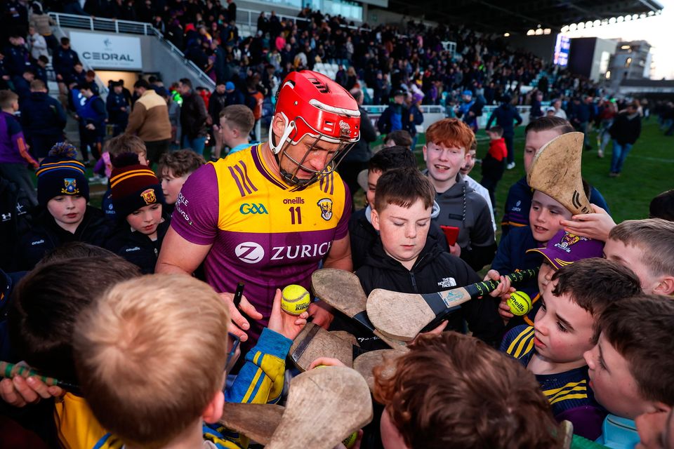 Lee Chin of Wexford signs autographs for young supporters after the match against Kildare. Photo by Michael P Ryan/Sportsfile