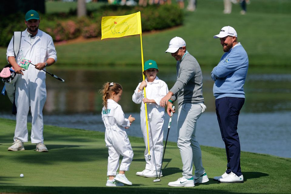 Golf - The Masters - Augusta National Golf Club, Augusta, Georgia, U.S. - April 8, 2026
Northern Ireland's Rory McIlroy with his daughter Poppy and Ireland's Shane Lowry during the par 3 contest REUTERS/Mike Blake