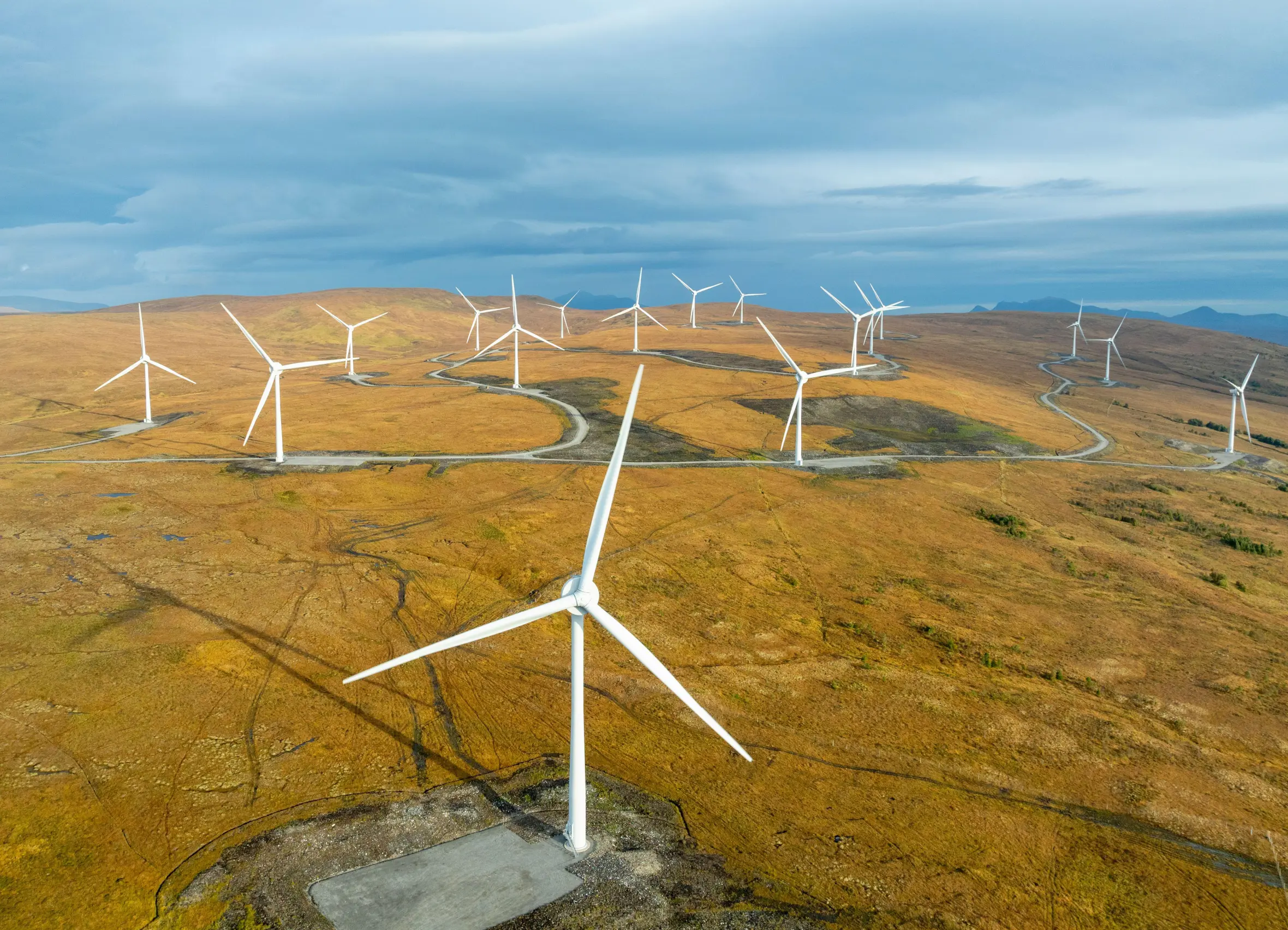 Aerial view of wind turbines in the Scottish Highlands.