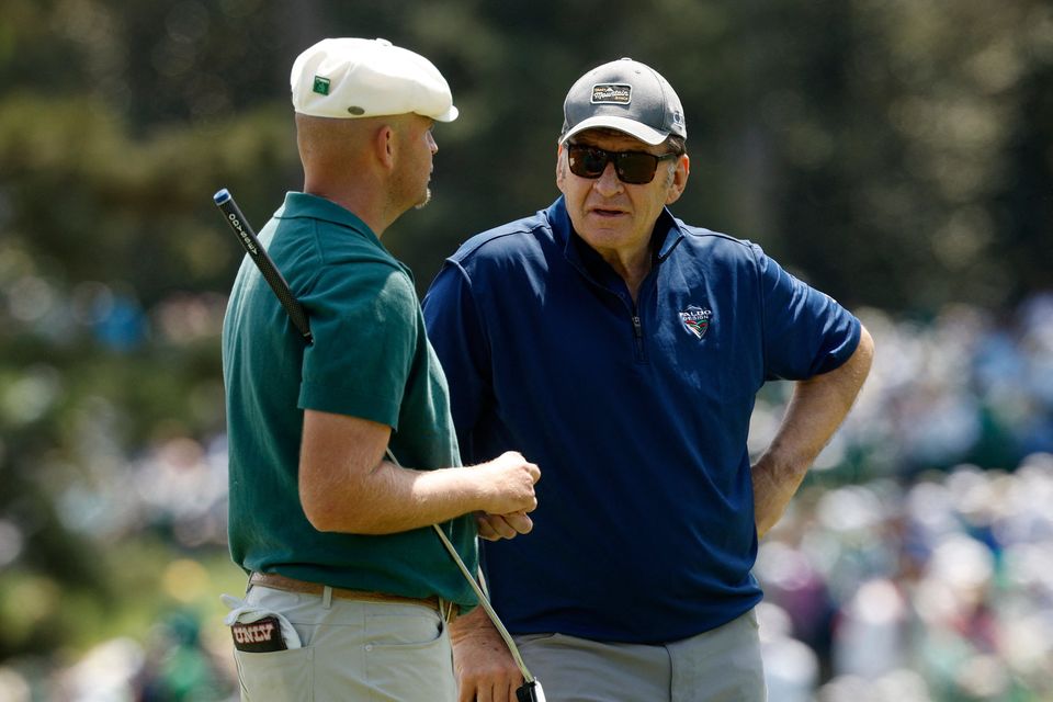 Golf - The Masters - Augusta National Golf Club, Augusta, Georgia, U.S. - April 8, 2026
England's Harry Hall with former golfer Nick Faldo on the 2nd hole during the par 3 contest REUTERS/Brian Snyder