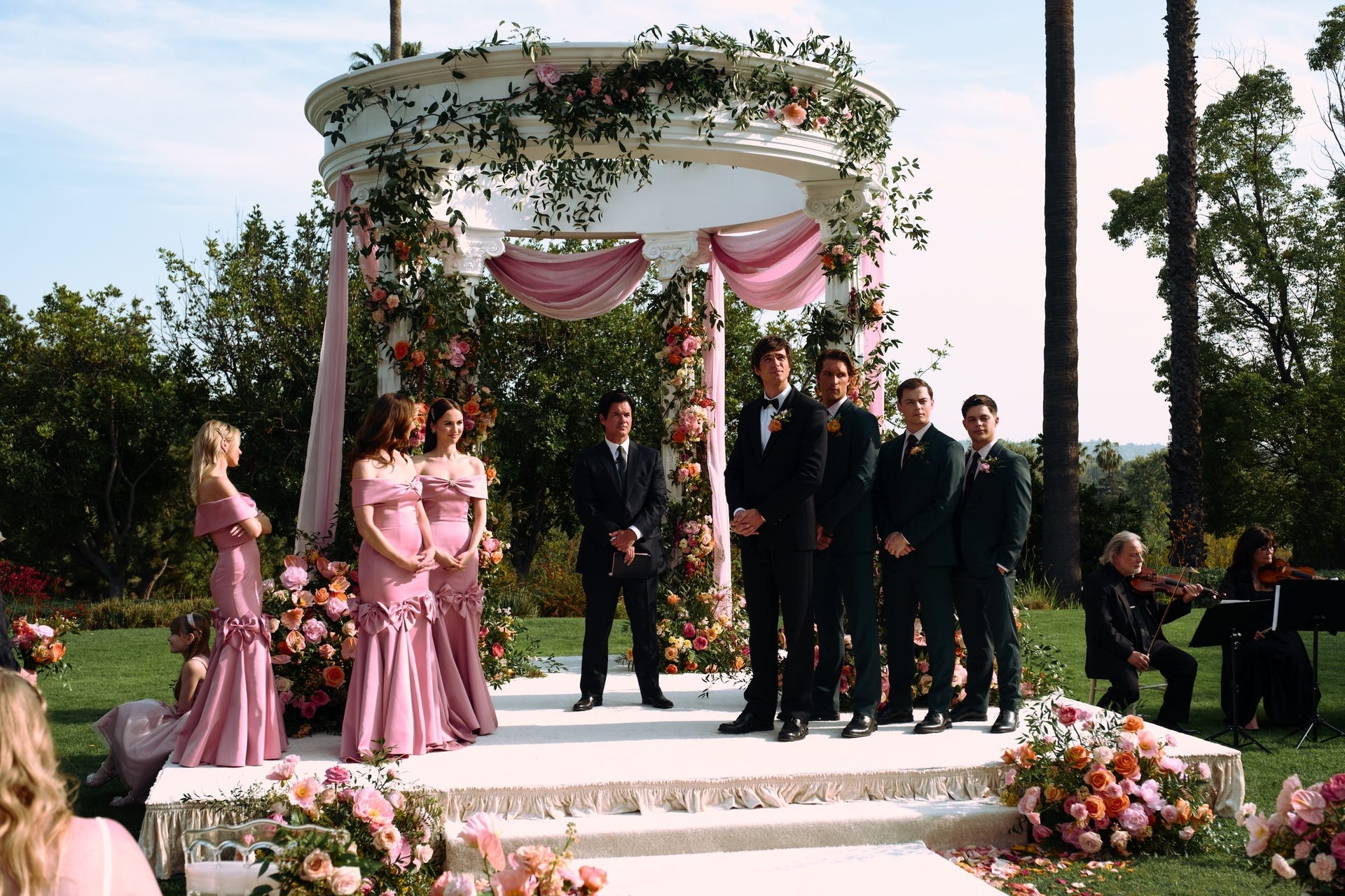 Wedding ceremony setup with floral decorations.