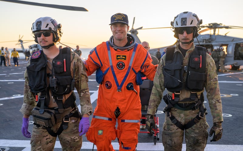 CSA (Canadian Space Agency) astronaut Jeremy Hansen, Artemis II mission specialist is assisted off the flight deck. Photograph: NASA/Bill Ingalls