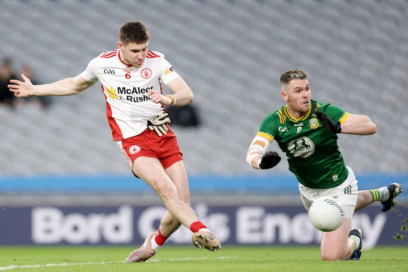 Niall Devlin scores Tyrone’s second goal despite a challenge by Meath's Bryan Menton in Croke Park on March 14th. Photograph: Laszlo Geczo/Inpho