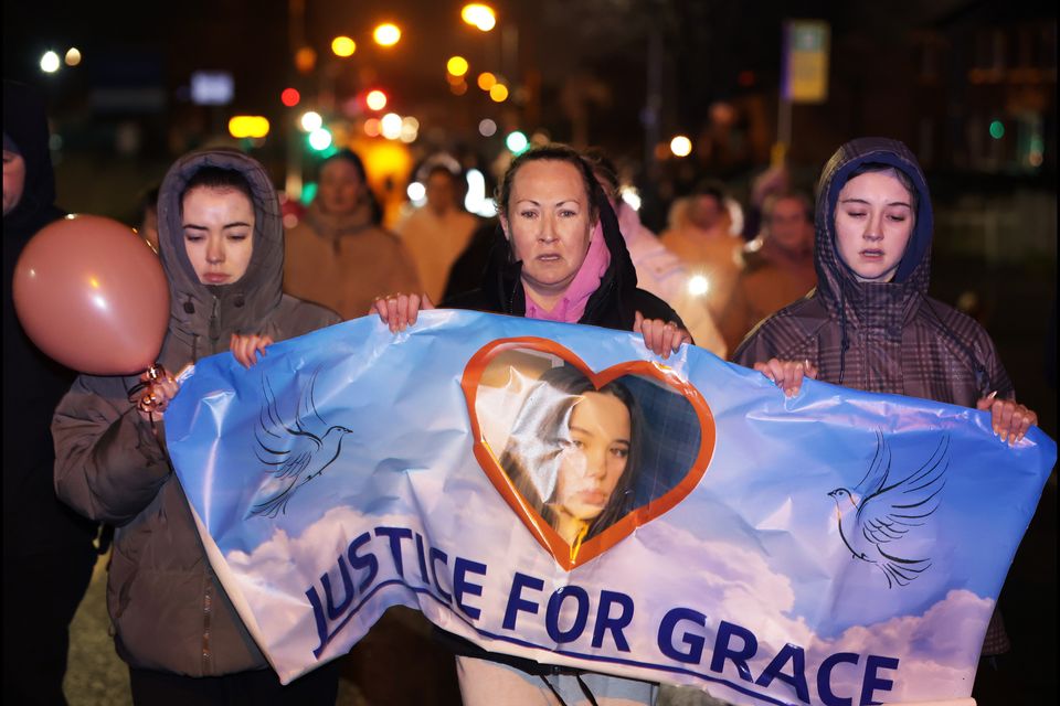 Siobhán Lynch (centre) at a vigil for her daughter, Grace, after she was killed by a scrambler near her home in January. Photo: Steve Humphries