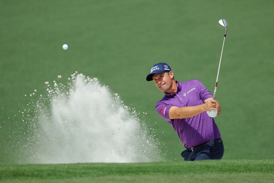Pádraig Harrington plays a shot from a bunker on the second hole during a practice round prior to the Masters at Augusta National Golf Club in April 2022. Photo: Andrew Redington/Getty Images