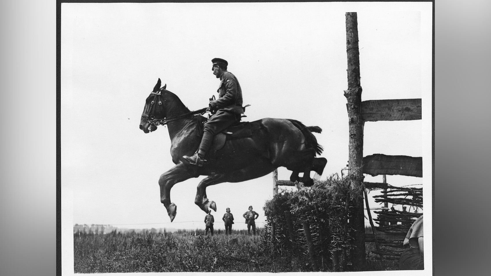 A WW1 British cavalryman riding a horse.